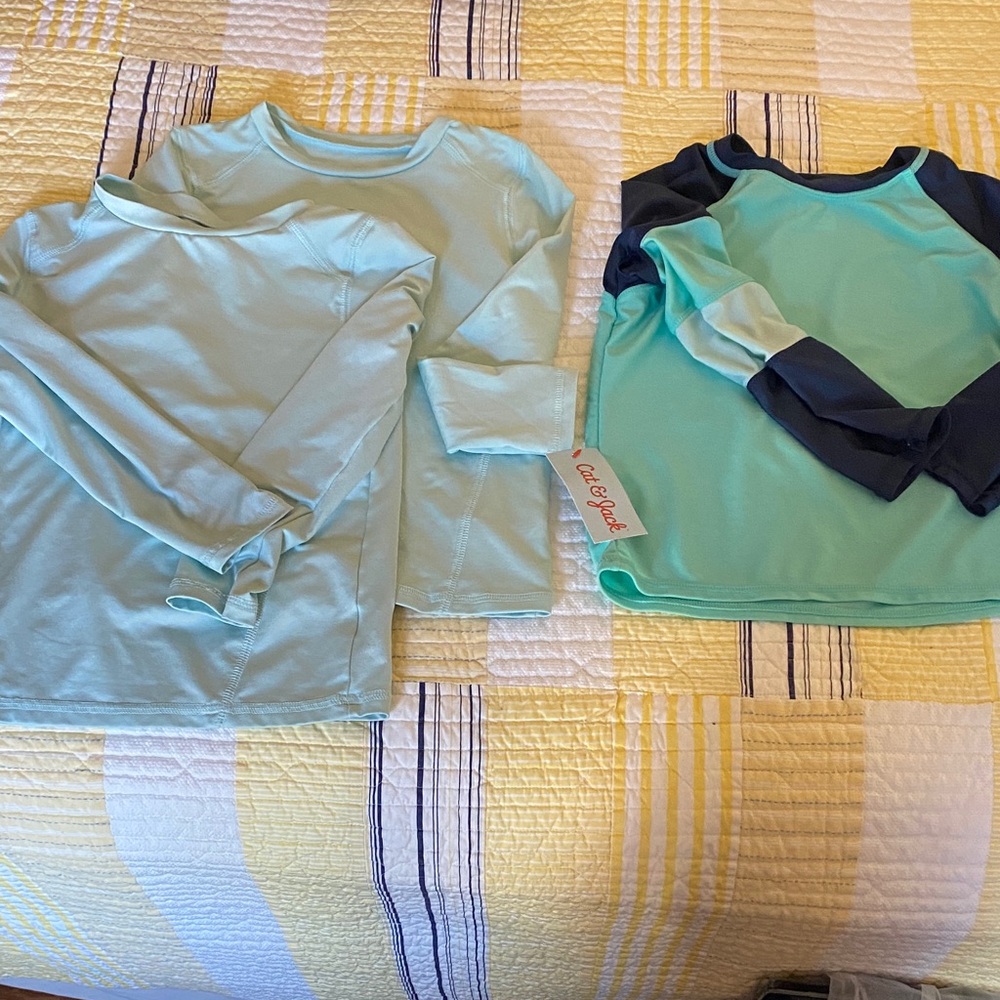 3 Boys Swim Shirts - 2 Light Green, 1 light green and navy sleeves.